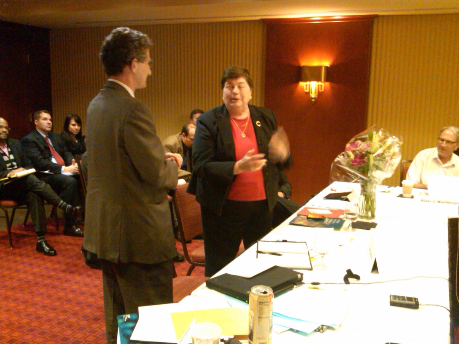 Dan Chenok (Chair, ISPAB) presents a bouquet to Cita Furlani (ITL Director, NIST) for her contribution and leadership.